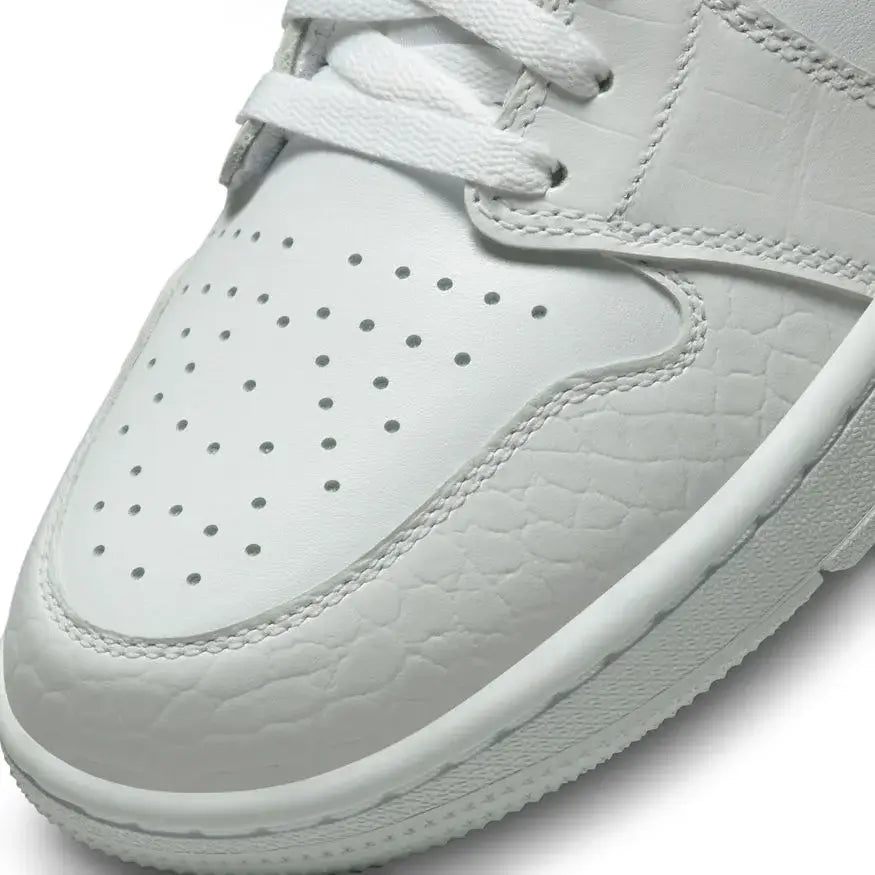 white sneaker with perforated design